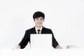 Asian manager businessman sitting at desk and working, isolated Royalty Free Stock Photo