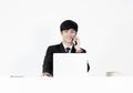 Asian manager businessman sitting at desk and working, isolated Royalty Free Stock Photo