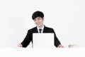 Asian manager businessman sitting at desk and working, isolated Royalty Free Stock Photo