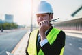 Asian manager engineer with hardhat,work outside industry,use digital tablet,radio communication control,with walkie talkie,work