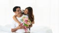Asian mature couple having romantic moment together with flowers bouquet Royalty Free Stock Photo