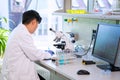 Asian medical doctor working in research lab. Science assistant making pharmaceutical experiments. Chemistry, medicine Royalty Free Stock Photo