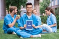 asian medical student holding tablet with loaded
