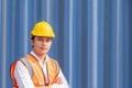 Asian men freight  worker wearing safety vest and hat while inspect condition of all containers shipment, People and worker in Royalty Free Stock Photo