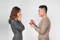 Asian man gives wedding ring and gift box to his woman Royalty Free Stock Photo