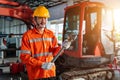 Asian men with large iron wrench in a hand, Powerful Professional Mechanic. Heavy Duty Equipment Maintenance. Industrial Concept