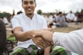 Asian men shake hands after Eid prayer Royalty Free Stock Photo