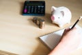 Asian men sit hand taking note by pencil and plan for his financial saving. Retirement or tax saving plan with copy space for text Royalty Free Stock Photo