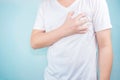 Asian men use hands to hold their hearts. Showing pain from heart disease,Heart attack symptom Healthcare and medical concept Royalty Free Stock Photo