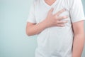 Asian men use hands to hold their hearts. Showing pain from heart disease,Heart attack symptom Healthcare and medical concept Royalty Free Stock Photo