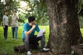 Asian man was sit,cry and reading a sad letter about work,the company is canceling employment,male person feel disappointed with