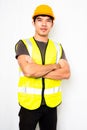Asian men wear green reflective safety shirts and yellow helmet on white background, concept Safety vests for visibility at work