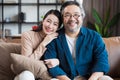 Asian Middle-aged Asian couple smiling at the camera. Family couple portrait. Royalty Free Stock Photo