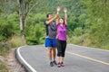 Asian middle aged couple stretching muscles before jogging Royalty Free Stock Photo