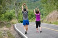 Asian middle aged couple stretching muscles before jogging Royalty Free Stock Photo