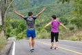 Asian middle aged couple stretching muscles before jogging Royalty Free Stock Photo