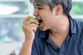 men Eating fruit Which is green apple Royalty Free Stock Photo