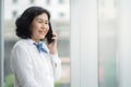 Asian middle business woman are calling