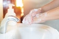 Asian Mom women wash her kid hand with soap alcohol gel for sanitizer in kitchen sink concept for prevent Hygiene health care.