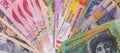 Colorful banknotes in fan on wooden table Royalty Free Stock Photo