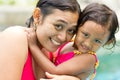 Asian mother and child in swimsuit