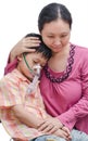 Asian mother comforts her son Royalty Free Stock Photo