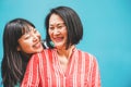 Asian mother and daughter having fun outdoor - Happy family people enjoying time togehter - Love, parenthood lifestyle, tender Royalty Free Stock Photo