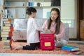 Asian mother and daughter packing backpacks Royalty Free Stock Photo