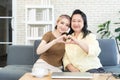 Asian mother and daughter smiling and fill happy show heart with their hands together, Happy family concept. Royalty Free Stock Photo