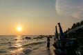 Asian mother and daughter walking on the beach in the morning at the East of the sea in Thailand