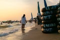 Asian mother and daughter walking on the beach in the morning at the East of the sea in Thailand