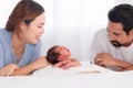 Asian mother and father with beard looking to newborn son crying, parenthood new mom and dad look at infant don`t know how to Royalty Free Stock Photo