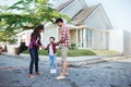 Asian mother and father with kid playing around of their house