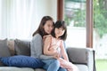 Asian mother feel hapiness during hug her cute daughter