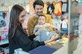 asian mother with her toddler boy shopping in the baby shop Royalty Free Stock Photo