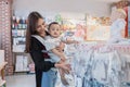 asian mother with her toddler boy shopping in the baby shop Royalty Free Stock Photo