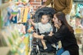 asian mother with her toddler boy shopping in the baby shop Royalty Free Stock Photo