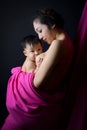 Asian mother holding and breast feeding her baby Royalty Free Stock Photo