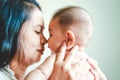 Asian mother hugs and kisses her son Royalty Free Stock Photo