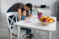 Asian mother kissing head of daughter Royalty Free Stock Photo