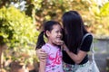 Asian mother kissing her daughter with love Royalty Free Stock Photo