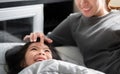 Asian mother play with her daughter on bed at bedroom,Woman use forefinger touching girl`s forehead with be kind, Single mom