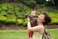 Asian mother playing with her 7 month old baby girl