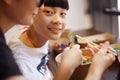 Asian mother & son have lunch in a restaurant Royalty Free Stock Photo