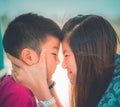 Asian Mother Son is kissing and hugging for Love and affection and Family togetherness concept Royalty Free Stock Photo