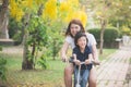 Asian mother and son riding bicycle Royalty Free Stock Photo