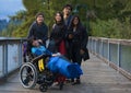 Asian mother with adult children and disabled son in wheelchair