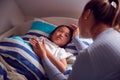 Asian Mother Talking To Daughter In Top Bunk Bed Before She Goes To Sleep Royalty Free Stock Photo