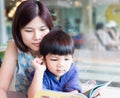 Asian Mother is teaching her son to read Royalty Free Stock Photo