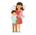 Asian mother with two children, boy giving flowers, daughter holding card with Mom . Family showing love, Mother s Day